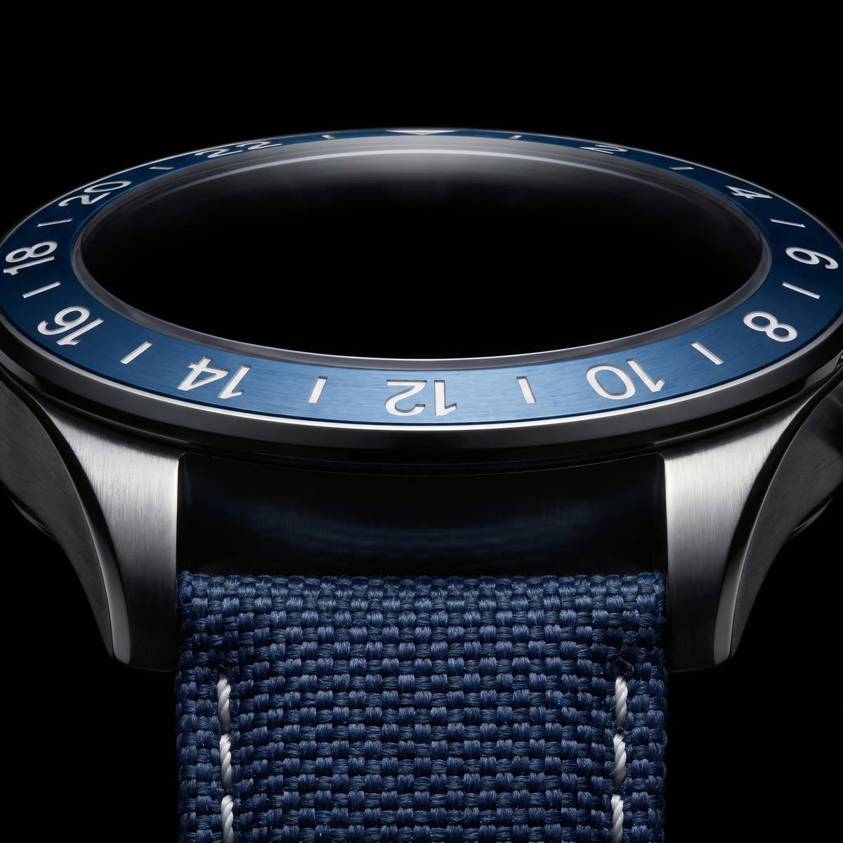 The 24-hour GMT bezel of The Navigator above the canvas strap